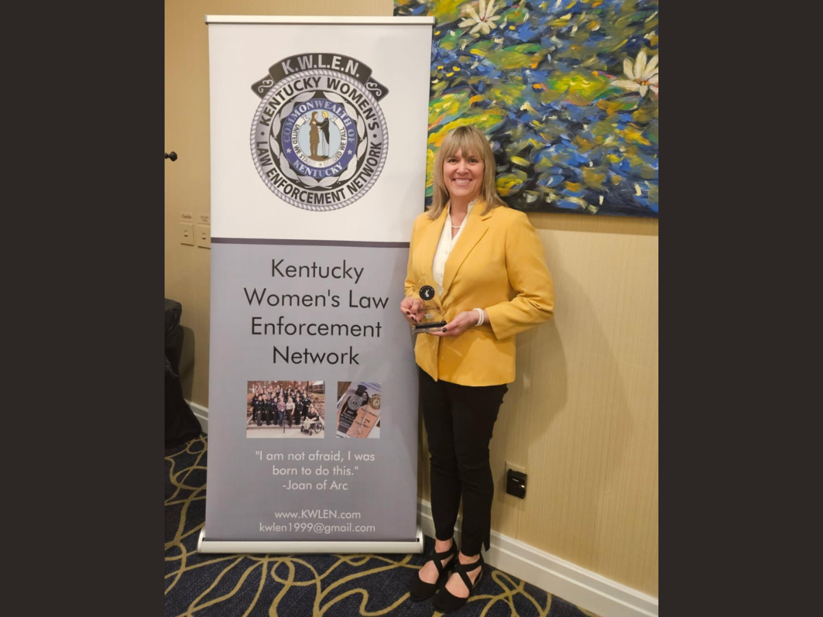 Melissa Moon with award