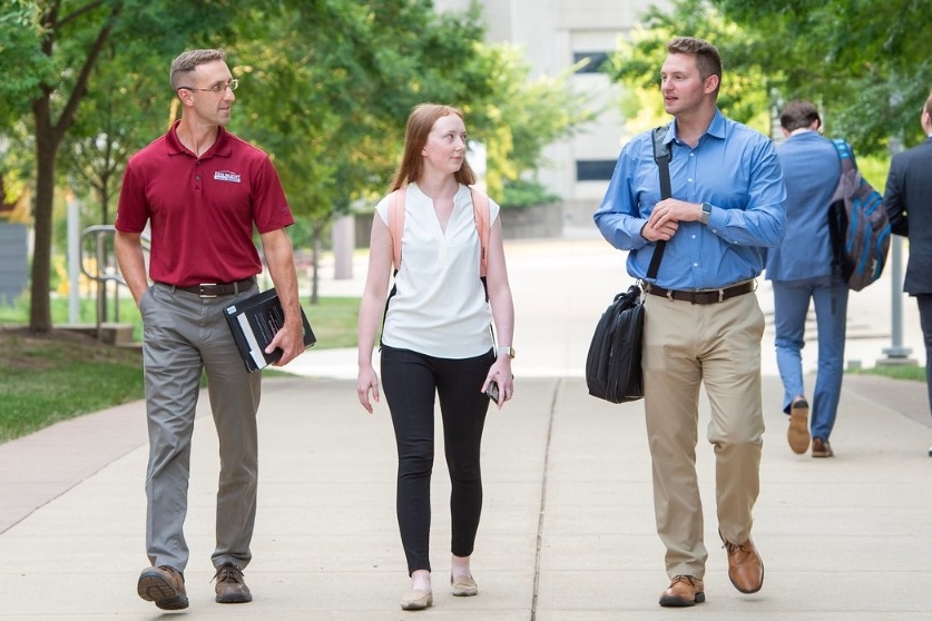 students walking across campus